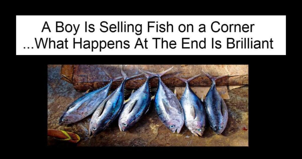 A Boy Is Selling Fish on a Corner