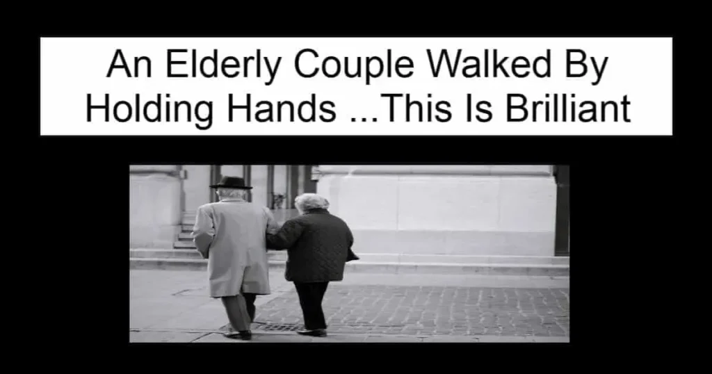 An Elderly Couple Walked By Holding Hands